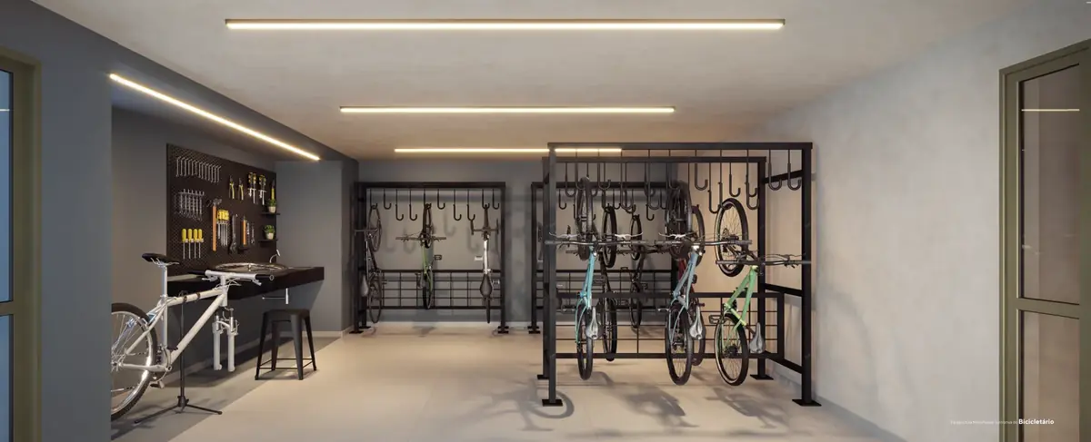 Bicicletário com suportes verticais e bancada de manutenção